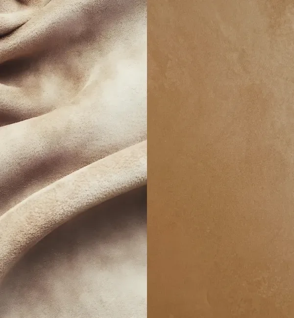 Close-up of two textured tan fabrics, one draped and soft, the other flat and smooth.