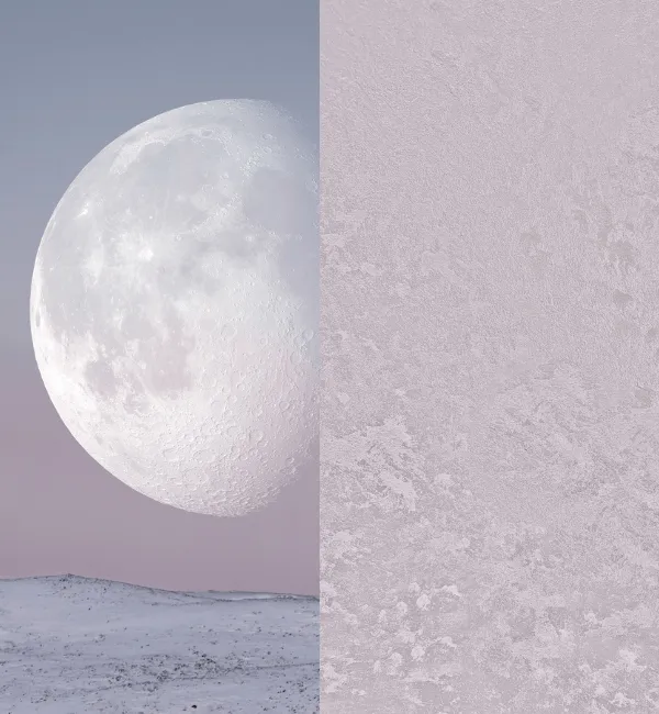 A large moon hangs over a snow-covered landscape with a textured surface on the right.